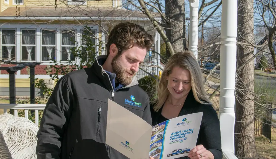 Mastertech Environmental reviewing mold inspection lab results with a homeowner in Myrtle Beach, SC and outlining next steps.
